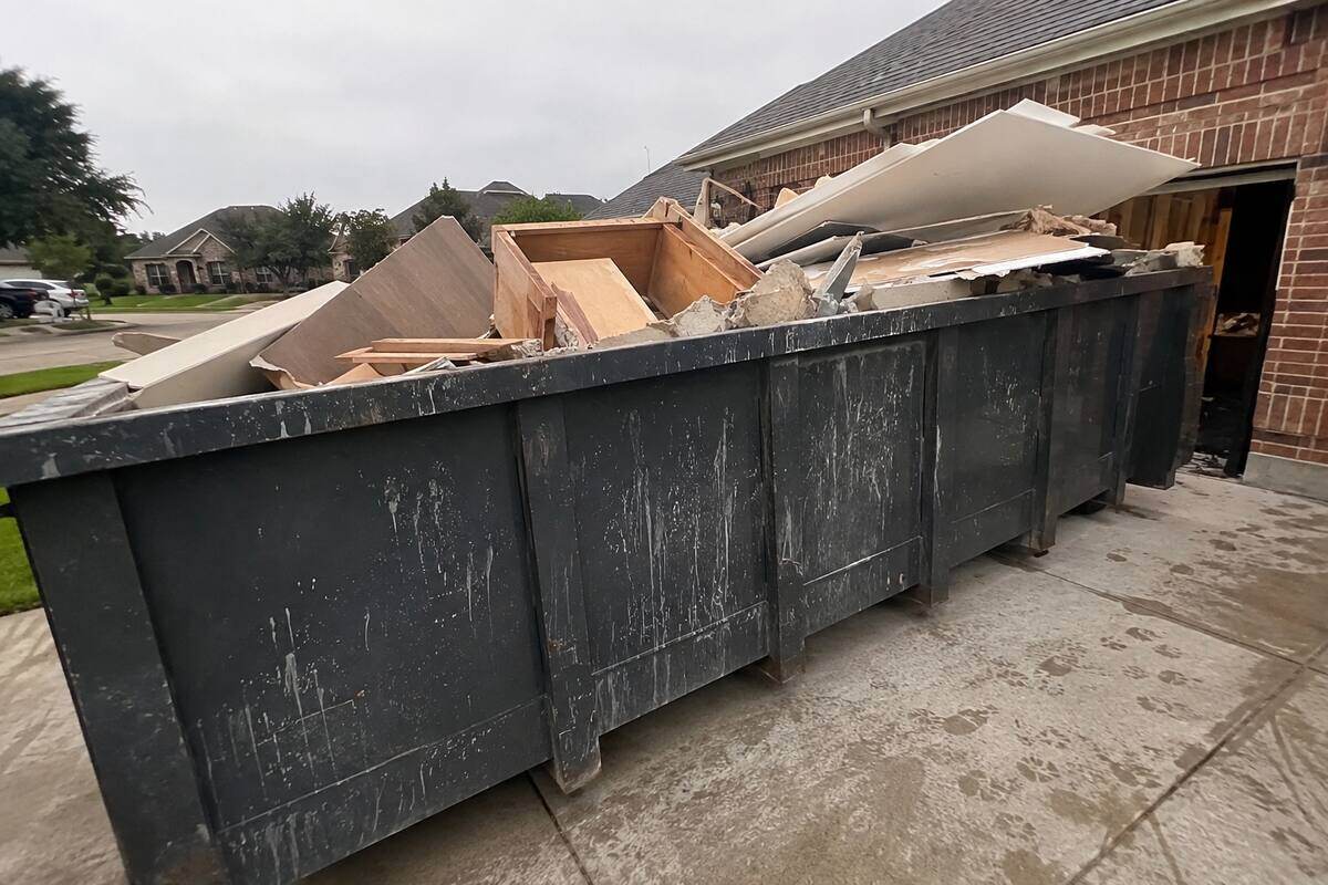 Dumpster filled with remodeling debris